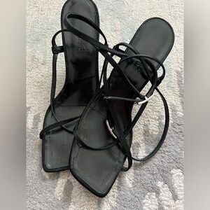 Hermes - authentic black strap sandal with kitten, heel embellished H hardware.